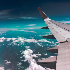 Airplane Wing Above Clouds